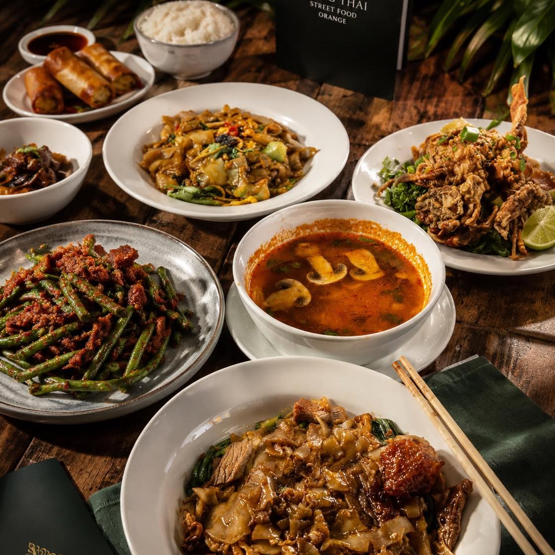 A spread of Thai dishes on a table at Gong Thai
